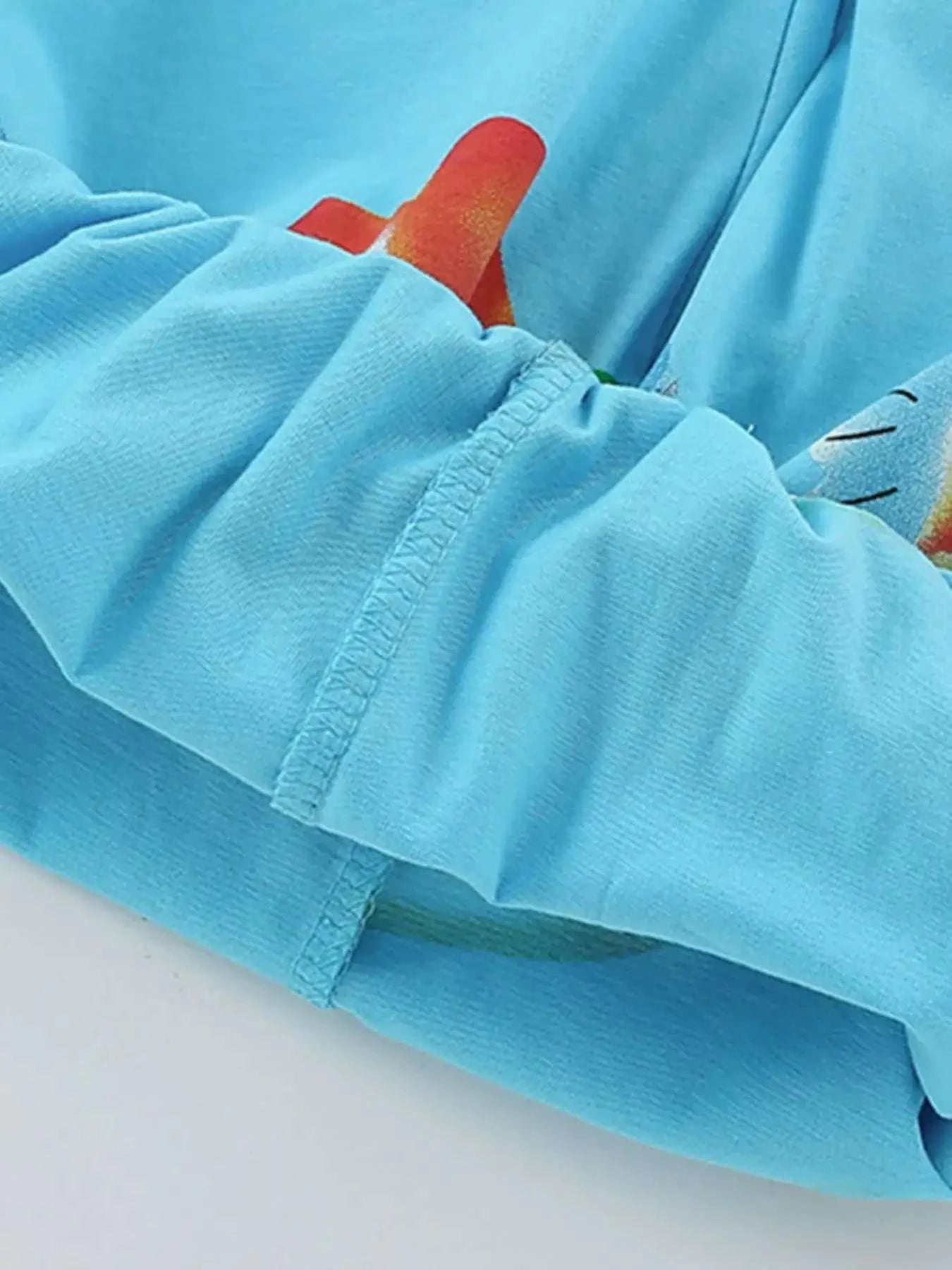 Light blue kids long-sleeve tee with gathered cuff detail at wrist