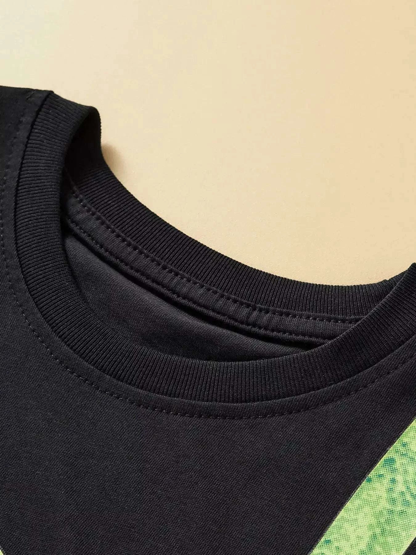Children's dino pizza graphic tee neckline, black crew neck with ribbed collar