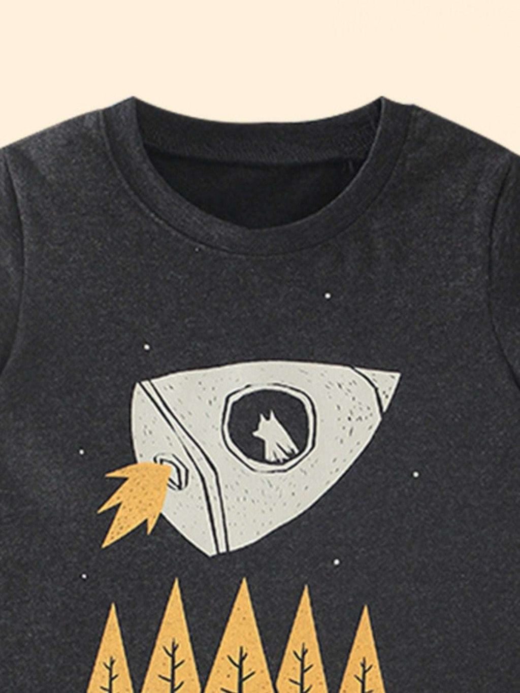 Kids black rocket graphic T-shirt, close-up of helmeted window and trees