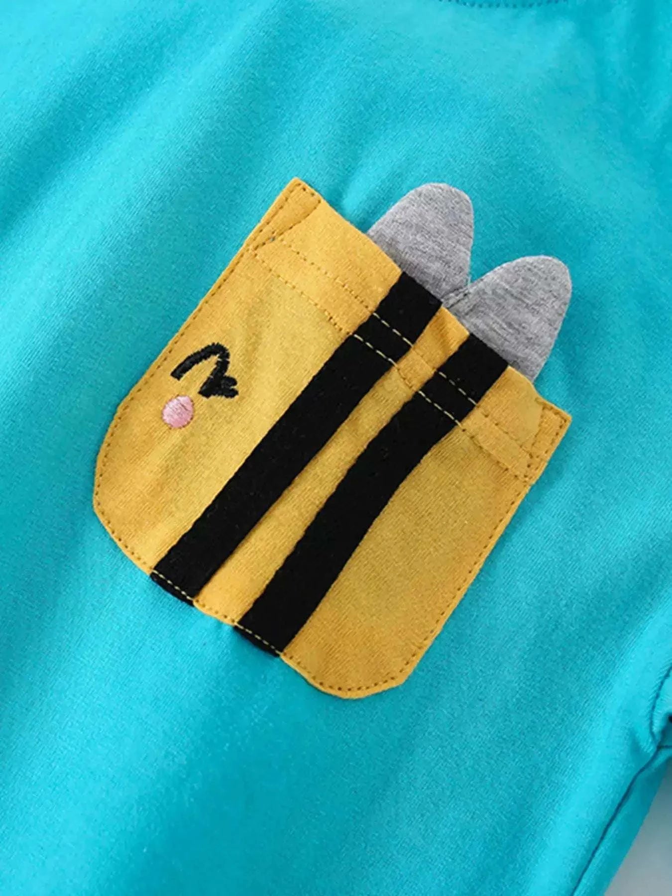 Children's aqua top front pocket graphic with striped yellow and heart details