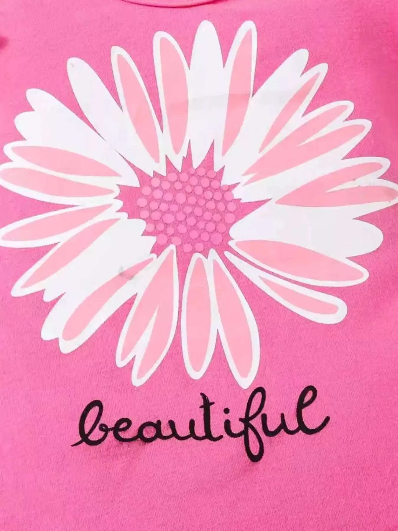 Children's fuchsia pink bodysuit with large daisy graphic and 'beautiful' text