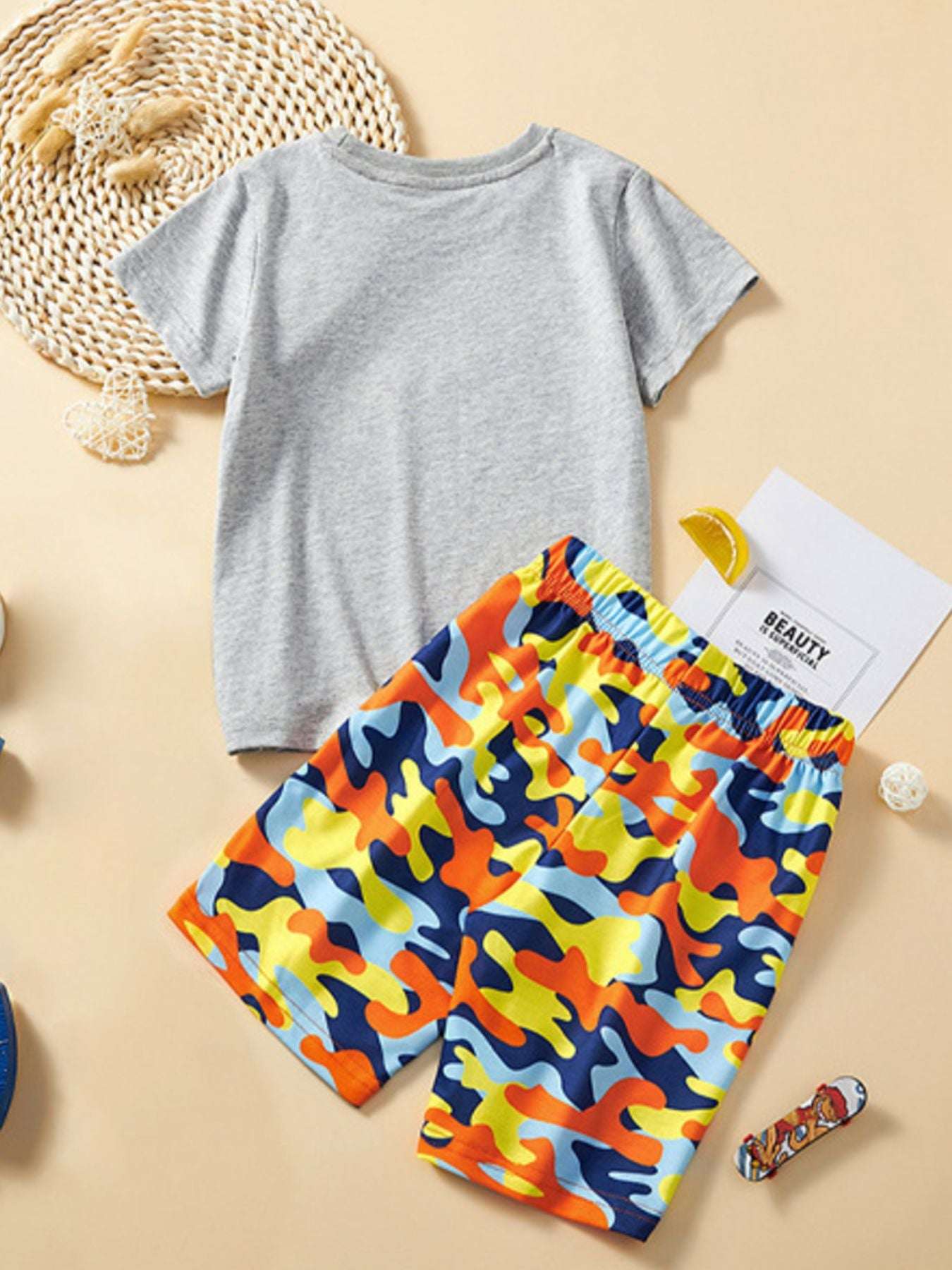Light gray crew-neck T-shirt with vehicle print and multicolor shorts set