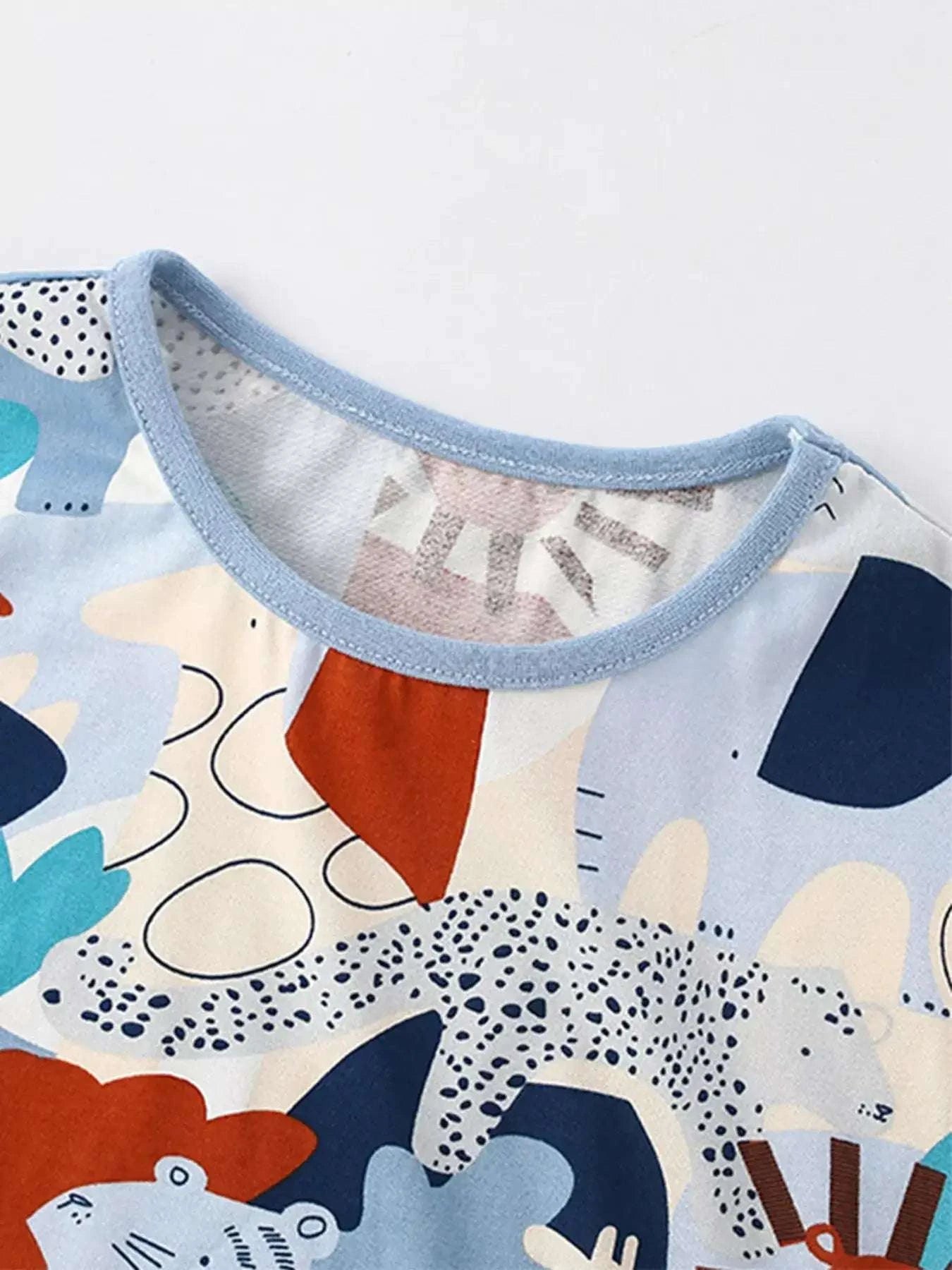 Kids' round-neck tee with light-blue trim and animal graphic print collar, multicolor