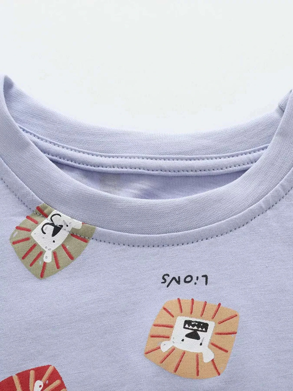 Light blue children's tee and shorts set with lion face graphic print