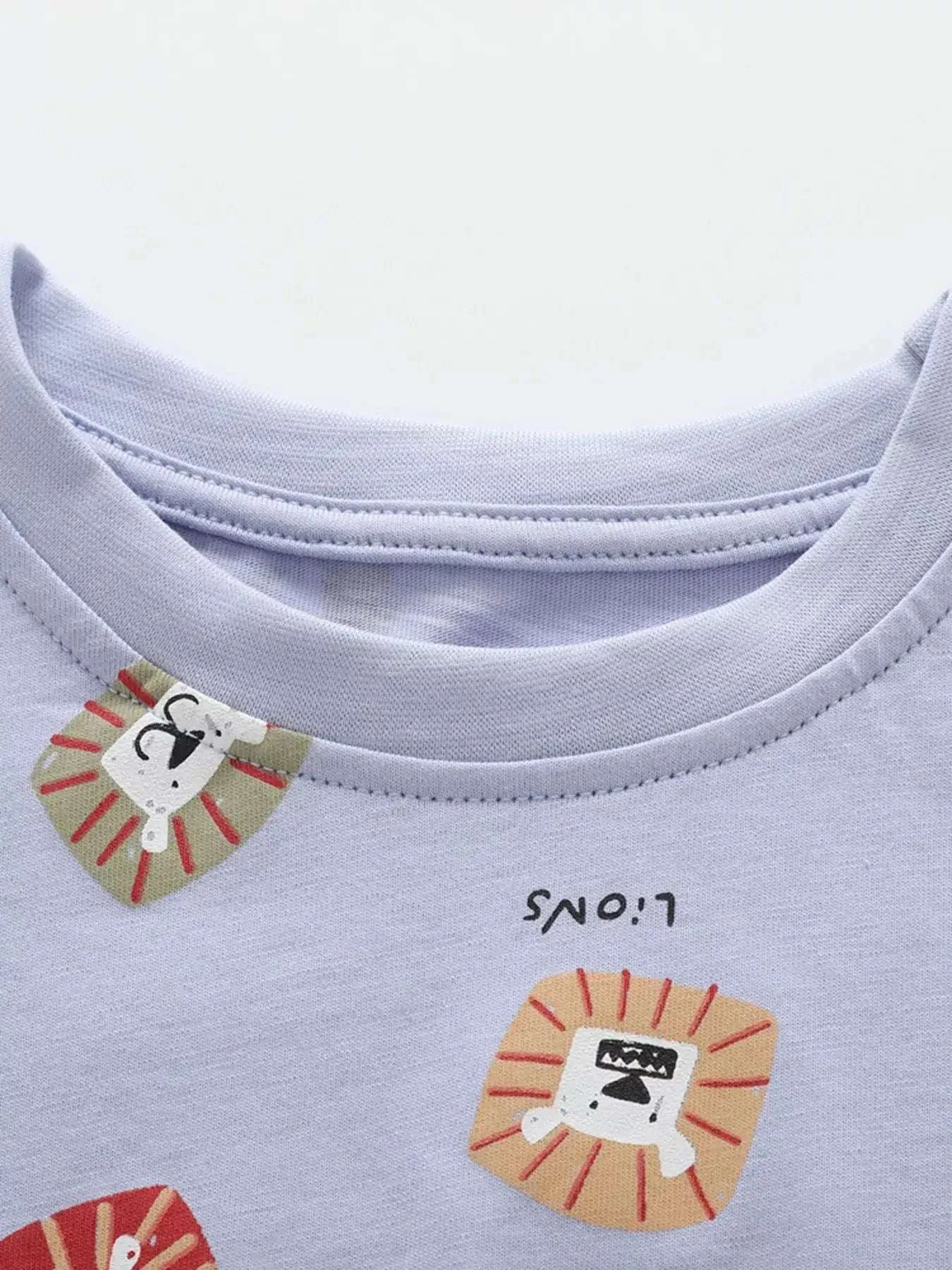 Light blue children's tee and shorts set with lion face graphic print