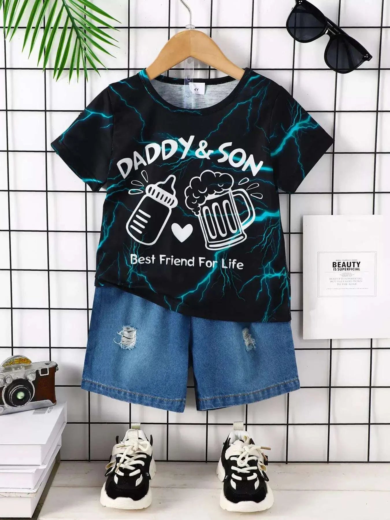 Black lightning print children’s tee and blue denim shorts set with rips