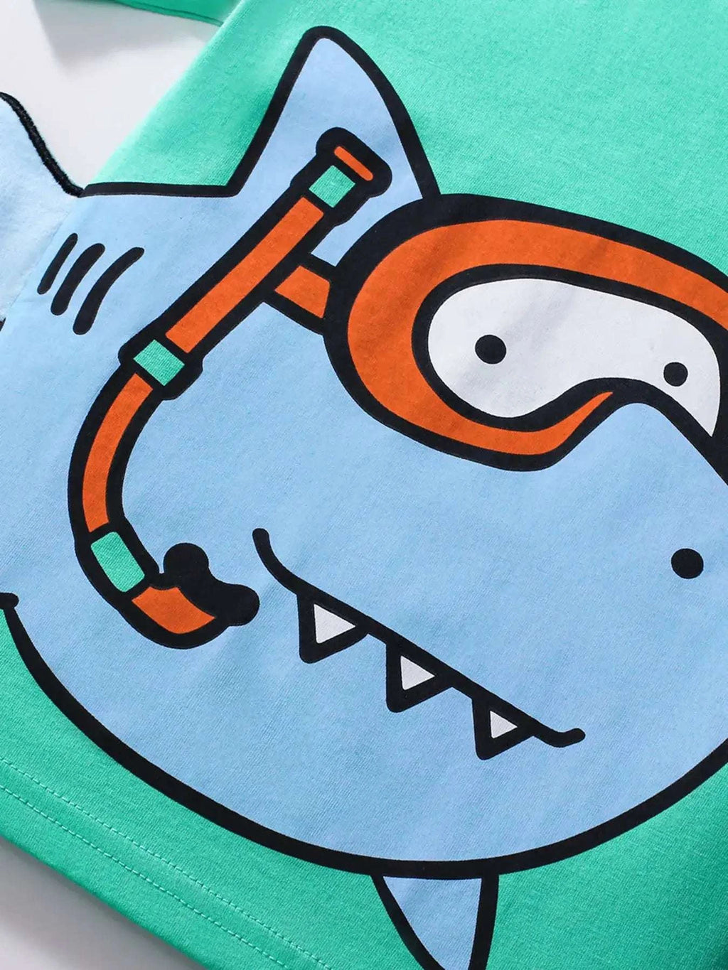Neon green kids T-shirt with cartoon shark graphic on chest
