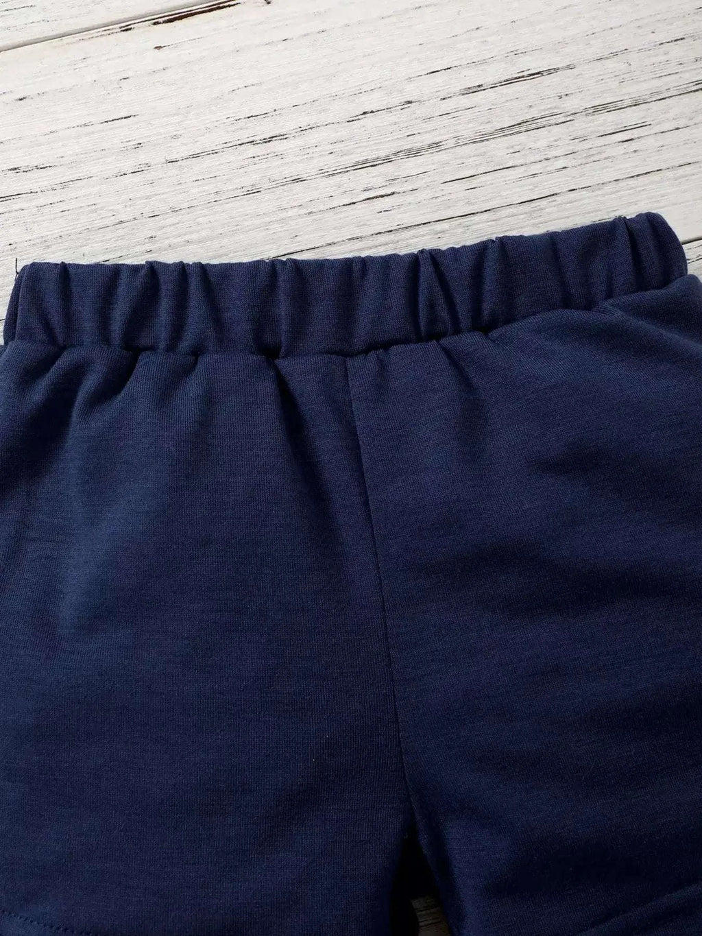 Navy kids shorts with elastic waistband and smooth solid knit