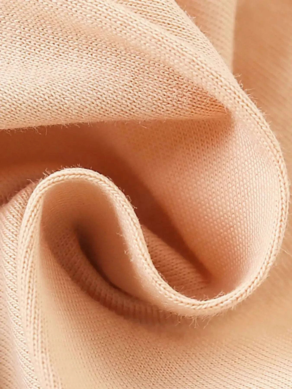 Apricot fabric ruffle sleeve detail with soft stitched edge