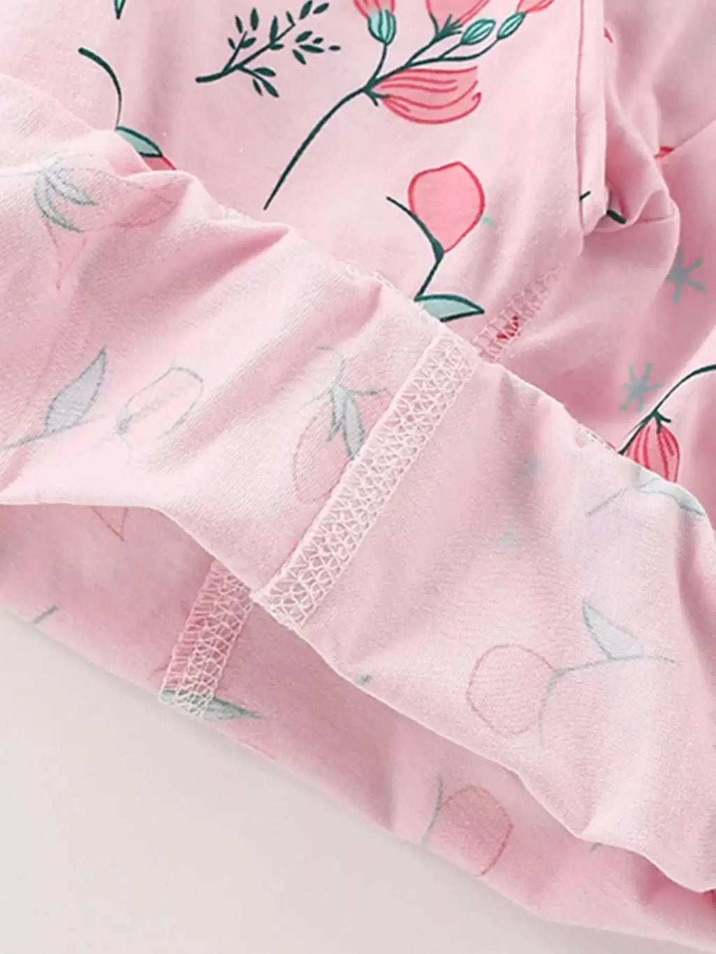 Blush pink kids short-sleeve tee with lace-trim cuff and floral print