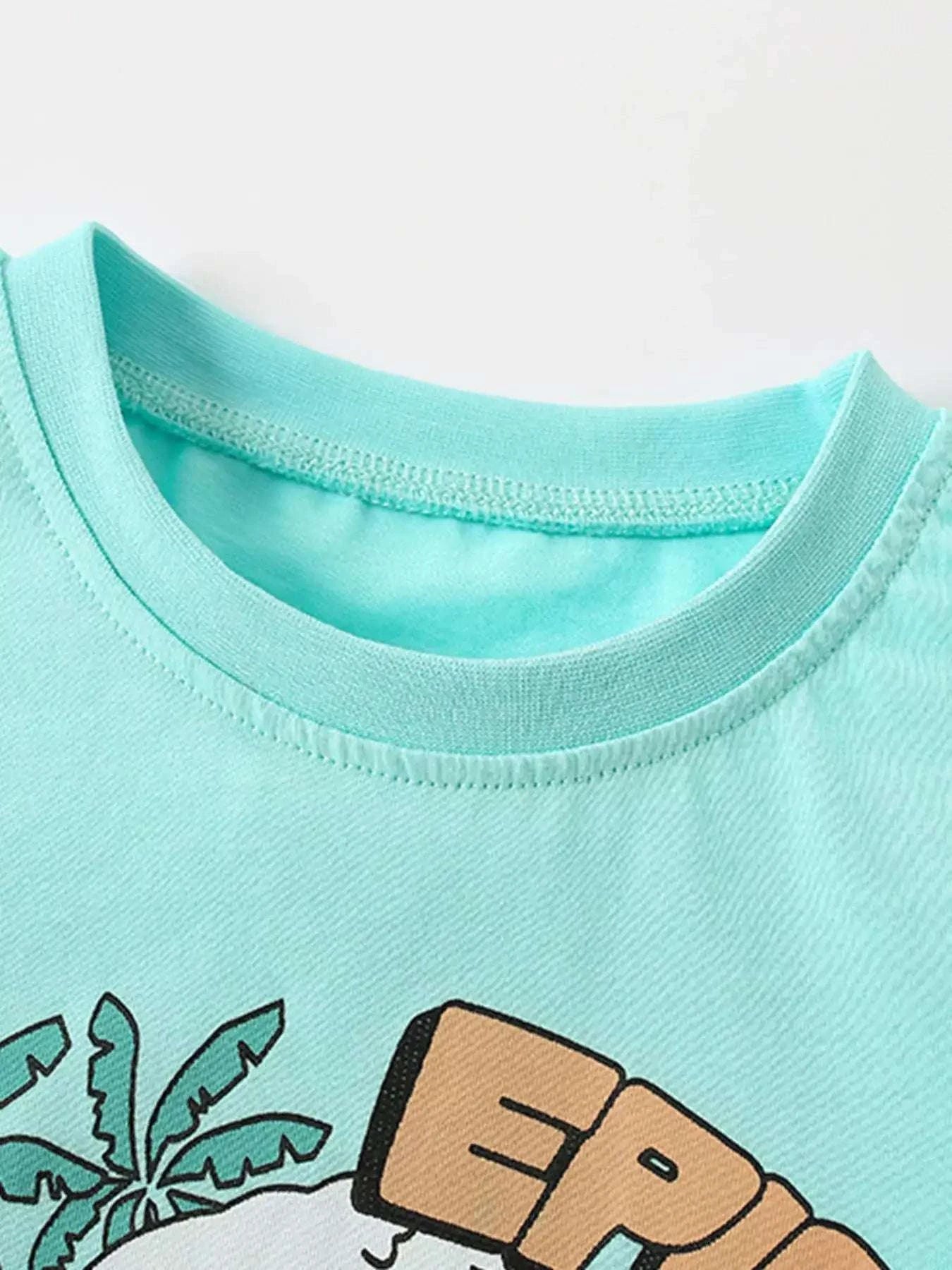 Aqua kids graphic T-shirt with crew neck and dinosaur surf scene print