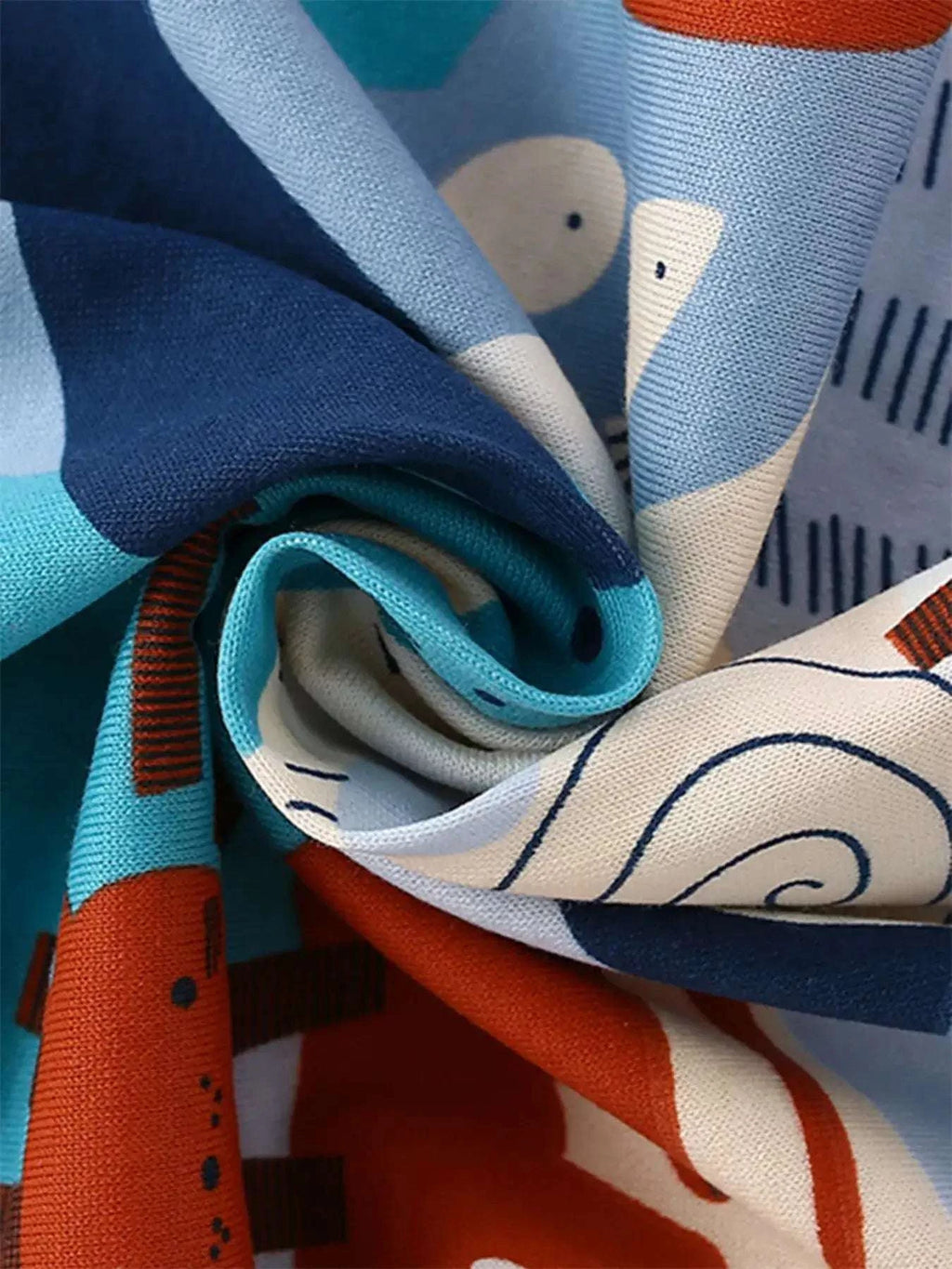 Printed fabric with animal motifs in blue and orange, for kids' tee and shorts set