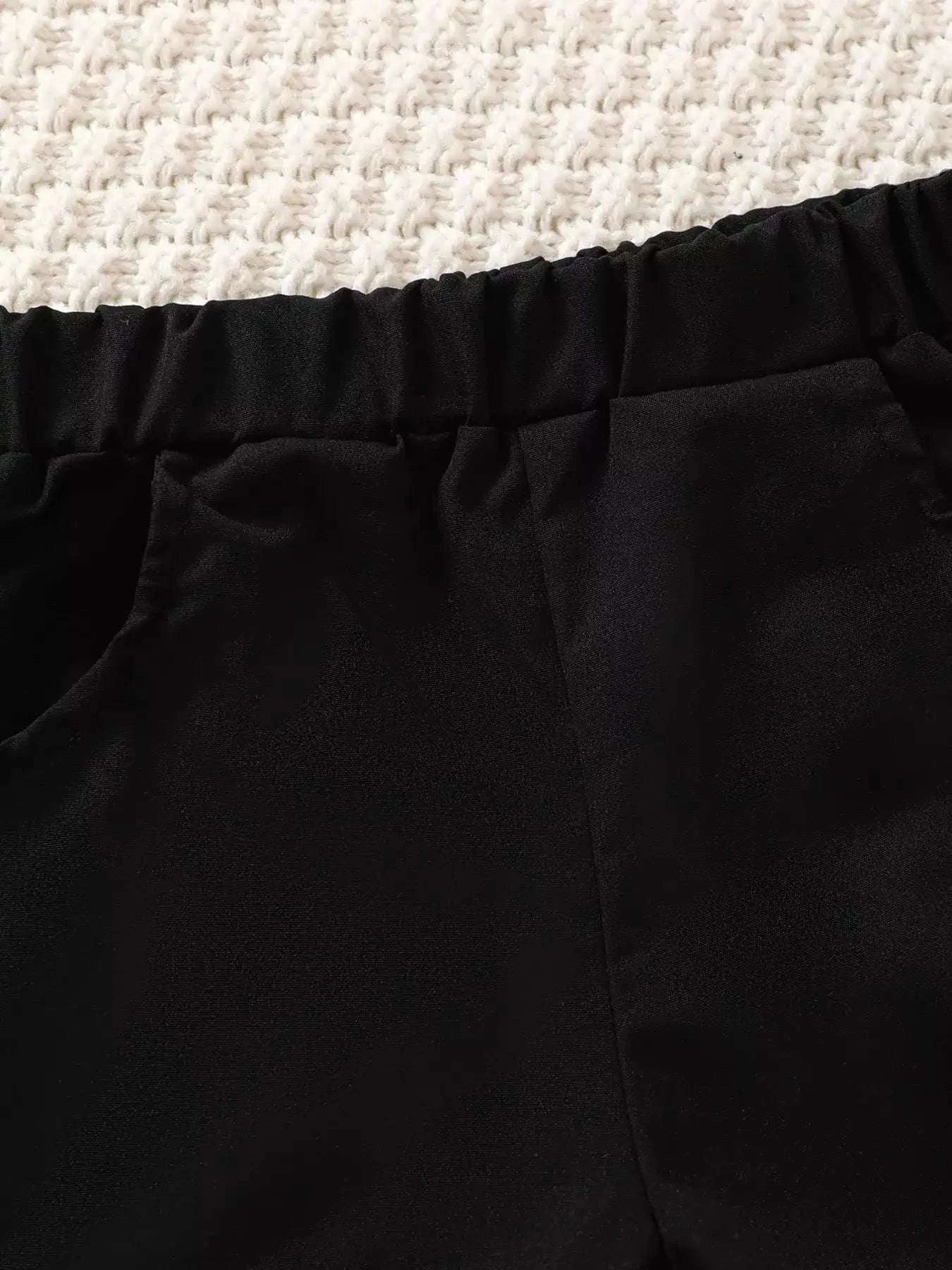 Black shorts with elastic waistband and stitched seam detail.