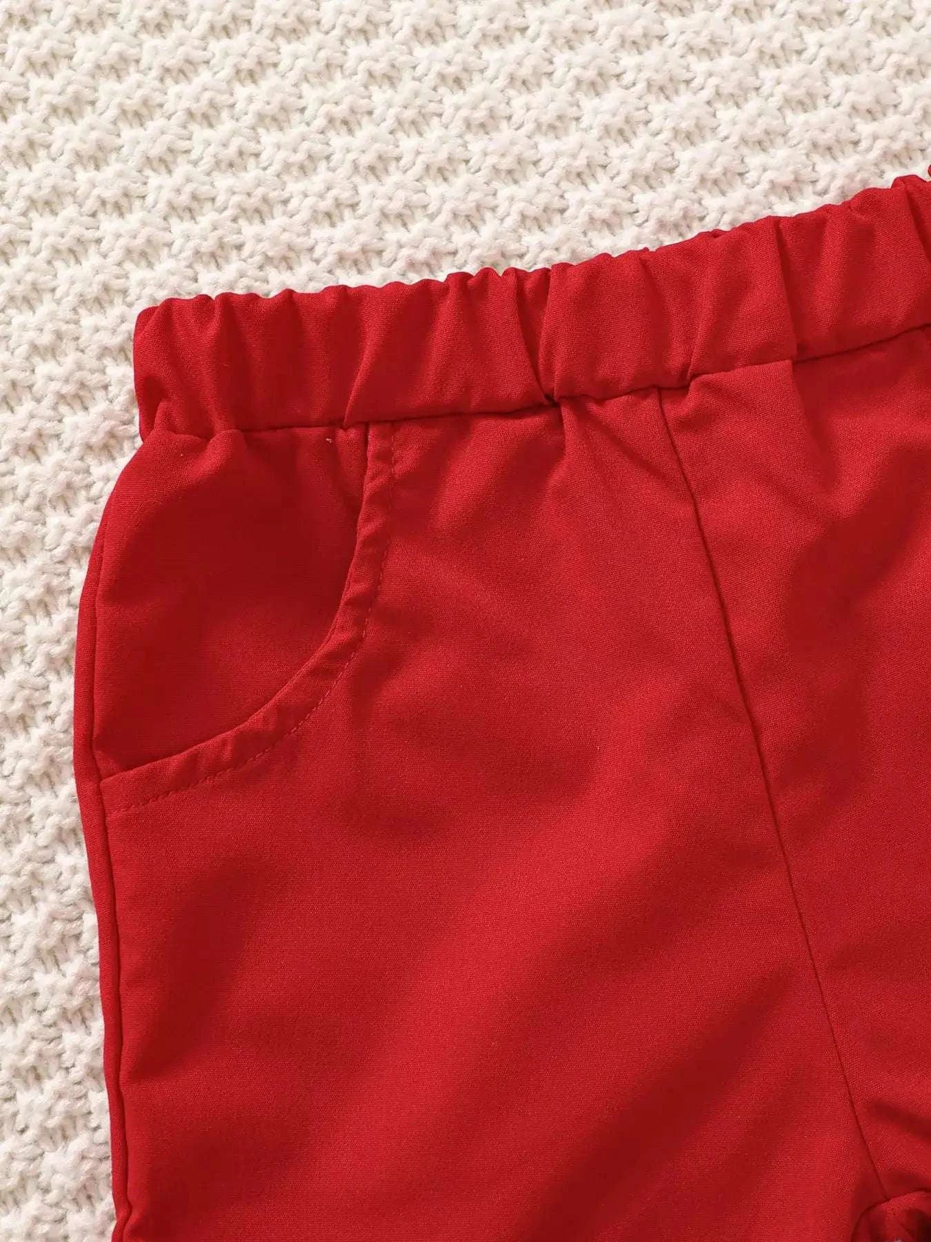 Red kids shorts with elastic waistband and stitched front seam