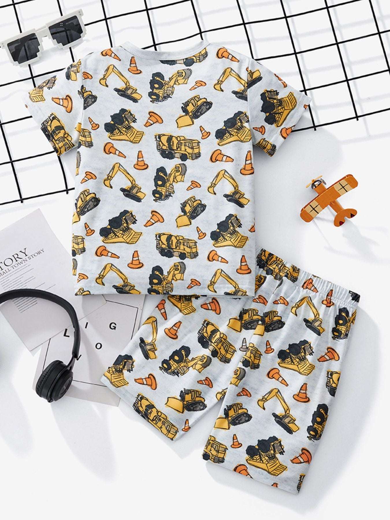 Kids construction print tee and shorts set, white with yellow, black, and orange vehicles
