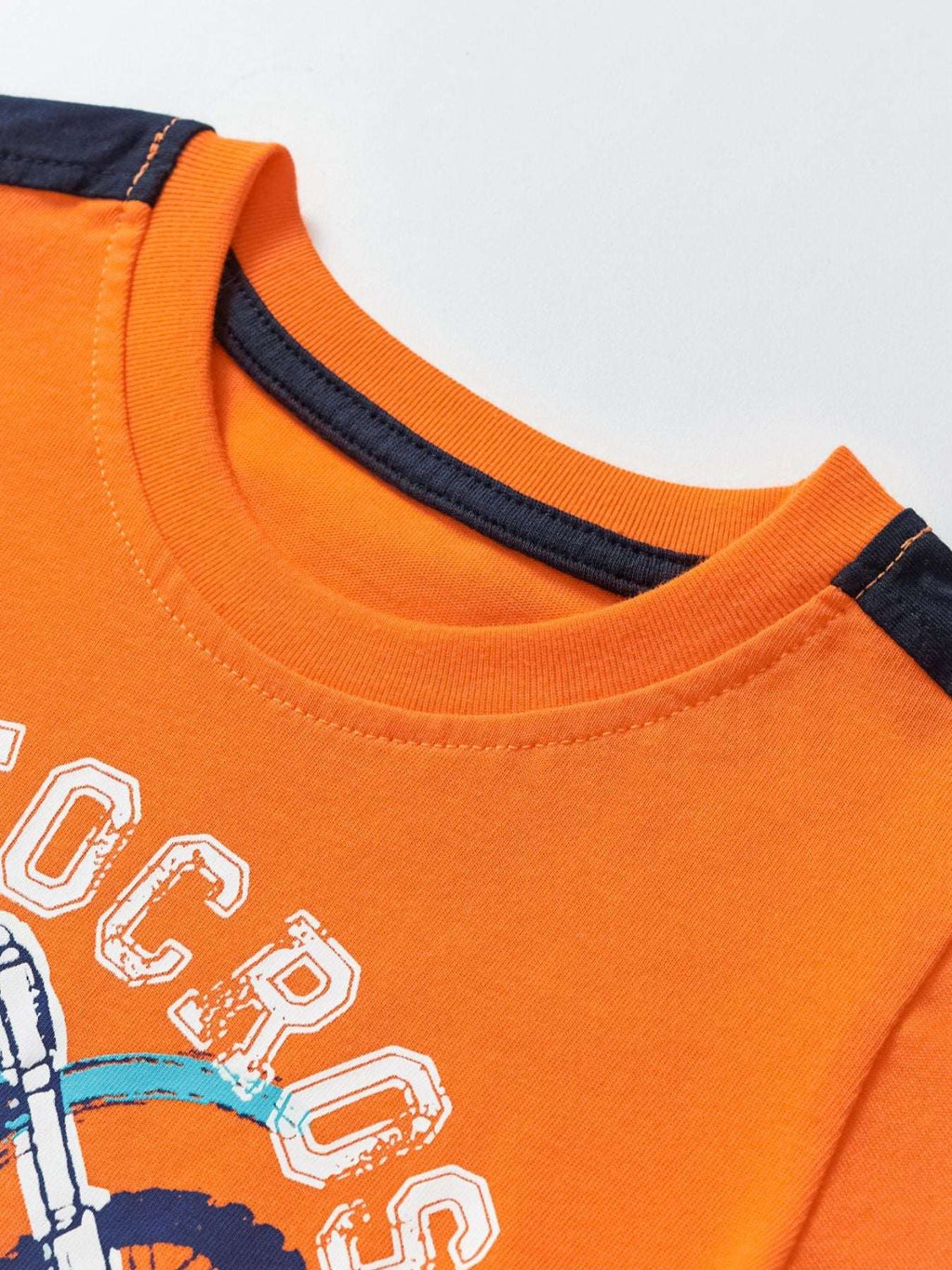 Children's orange short-sleeve tee with navy-trim collar and large graphic print