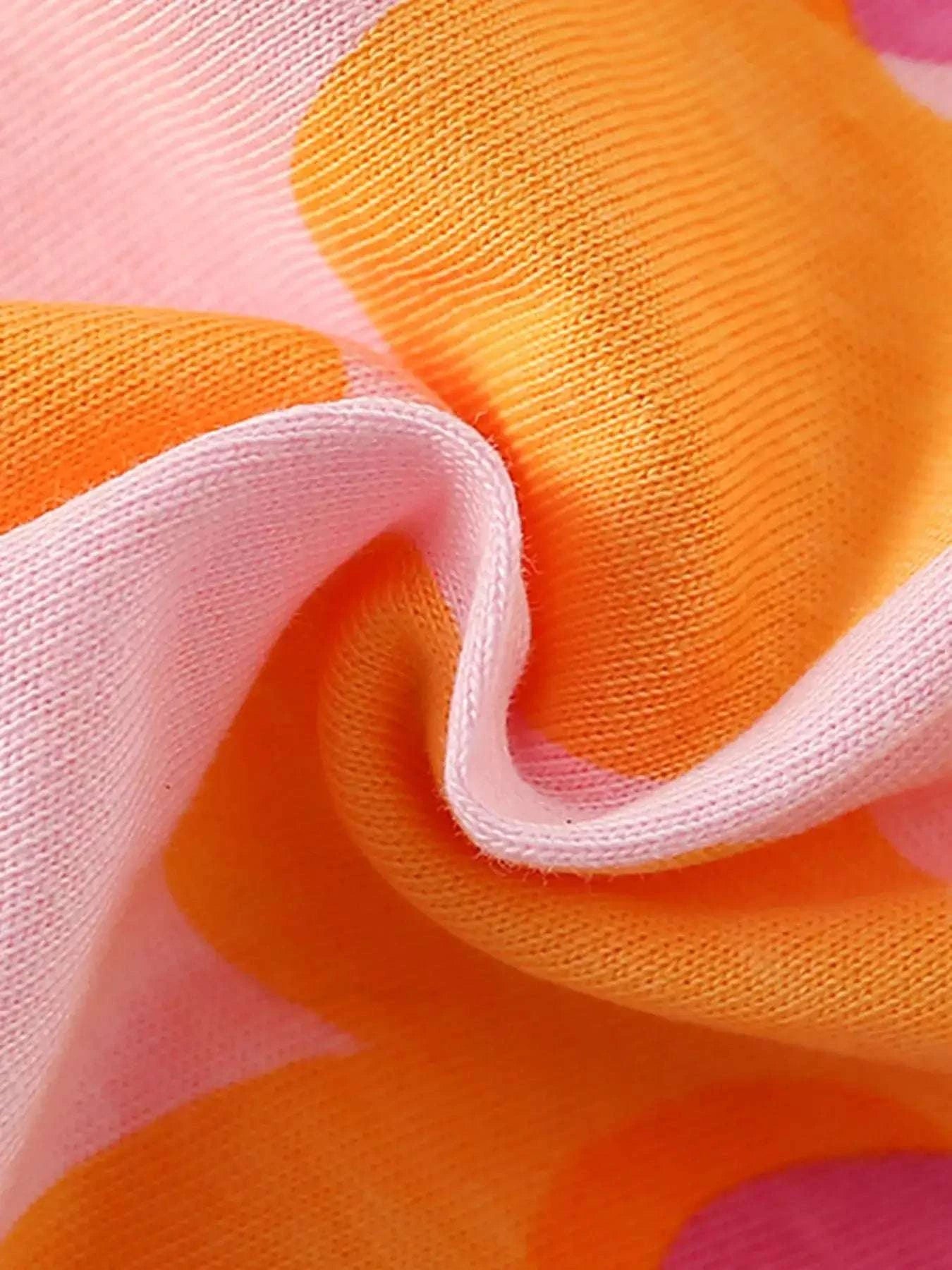 Girls pink knit tee fabric with orange floral print