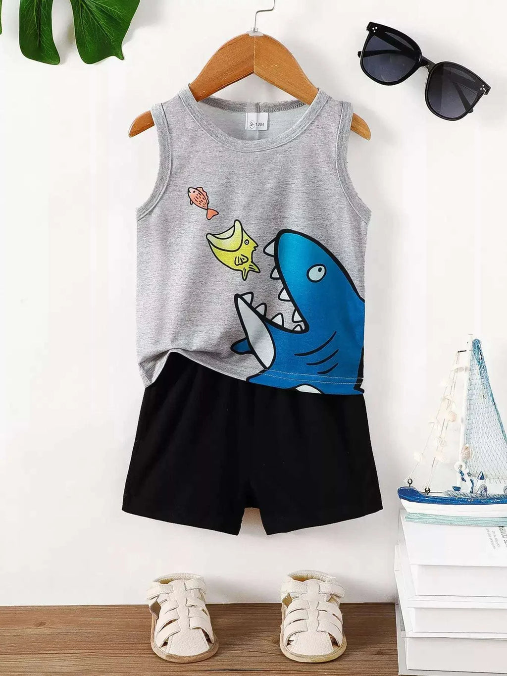 Kids shark graphic tank top and shorts set: gray tank with blue shark, black shorts.