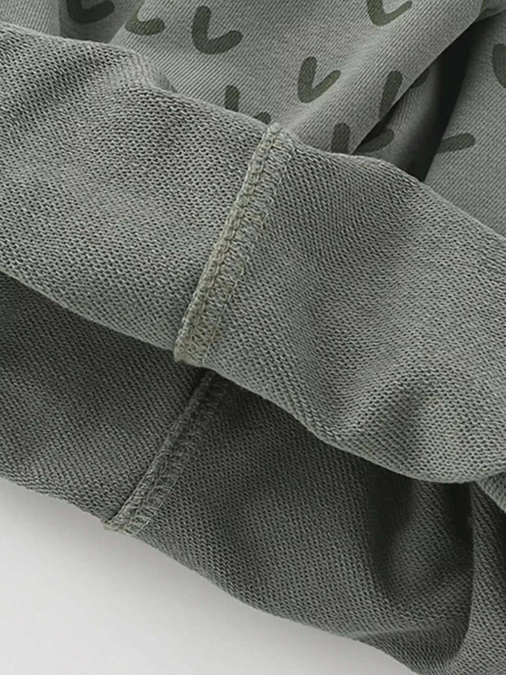 Gray-green kids' shorts with elastic waistband and crocodile pattern fabric
