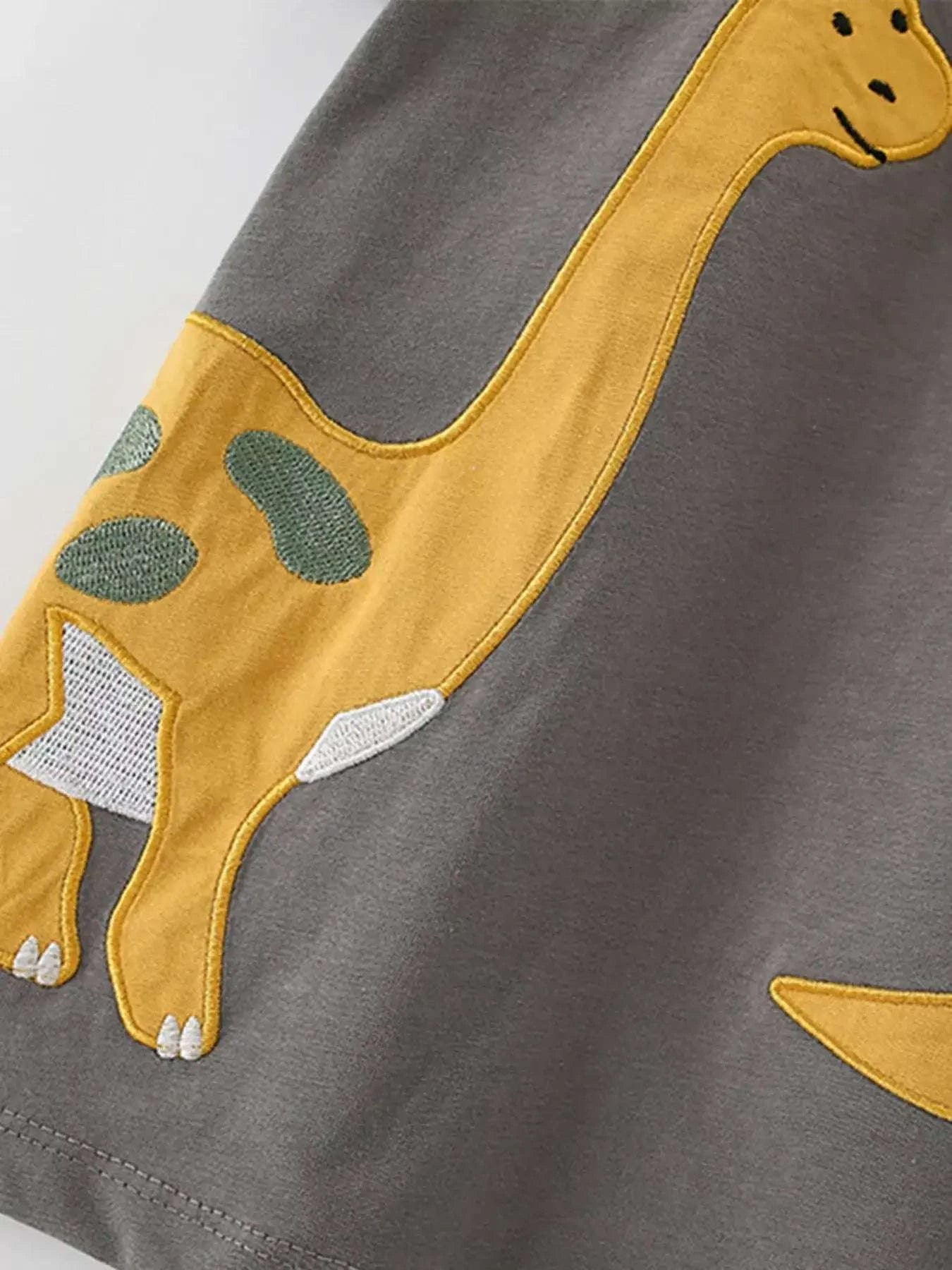 Dark gray kids t-shirt with large yellow dinosaur applique on chest