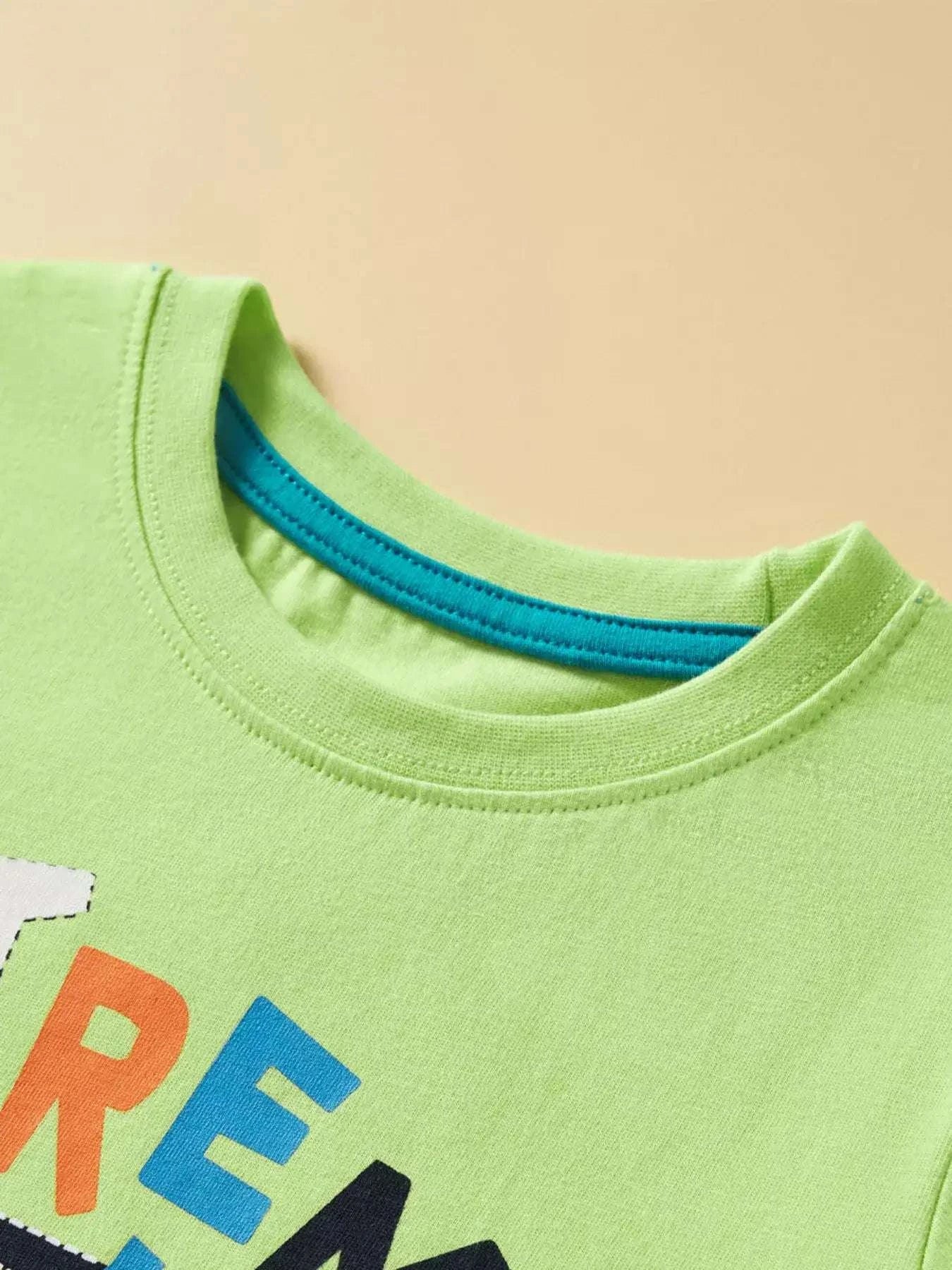 Neon green kids graphic T-shirt, crew neck with blue trim at collar