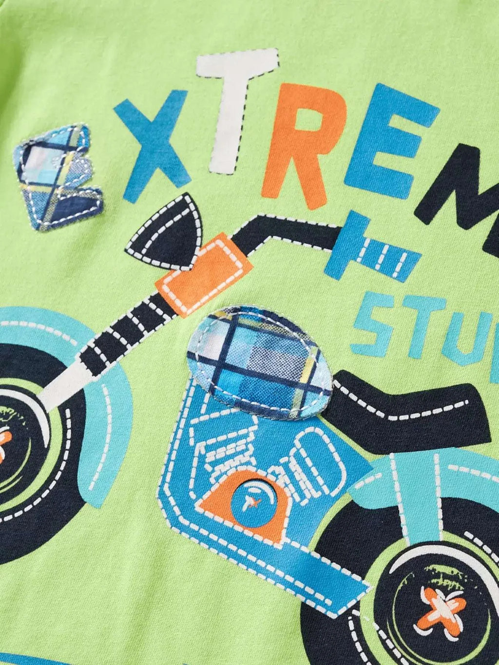 Neon green kids T-shirt with motorcycle stunt graphic and multicolor lettering